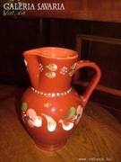 Large, handcrafted jug with marked handle