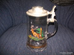 Bottle of beer with krigli hunter scene, 19 cm, nice tin lid.