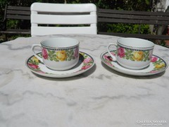 A pair of our great-grandmothers' flower-patterned teacups with a small plate