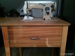 Lucznik sewing machine that can be hidden in a table