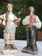 Antique large porcelain figurine in Slavic folk costume