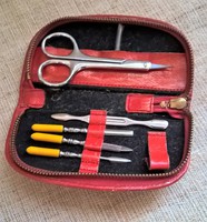 Old manicure set in a red case