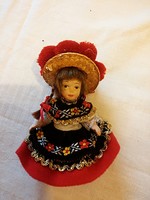 Porcelain doll in traditional clothes, small size