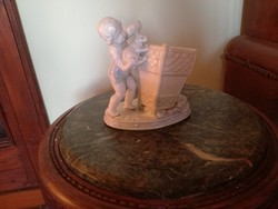 Putto with bunny, putto vase