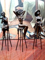 Ladies sitting in chair - bronze statues