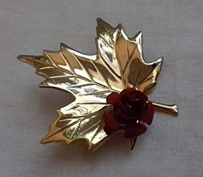 Gilded leaf-shaped brooch pin decorated with a small red rose