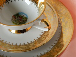 Brightly shining, richly gilded porcelain breakfast set with small plates