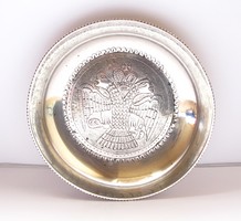 Old silver bowl decorated with a double-headed imperial eagle.