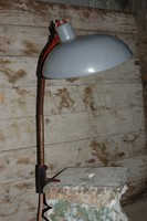 Workshop lamp with a large, enamelled metal shade.