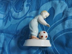 A small child playing with a ball - Zsolnay porcelain figure