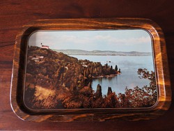 Old enamel bowl with waterfront landscape