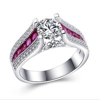 White gemstone ring, with small purple-pink stones on the sides, size 7