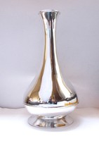 Showy silver-plated vase.