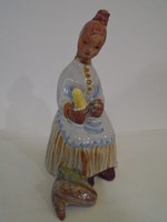 K.M. Signed; corn stripper lady pottery unfortunately her head is glued