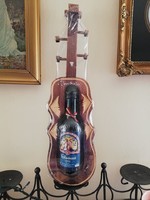 Wooden violin in a carved holder for a Romanian drink for a boyfriend