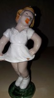Old ceramic little girl figurine in white dress with nipple