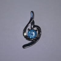 Silver colored pendant with blue swarovski stone