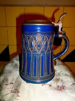 German ceramic jug with tin lid.