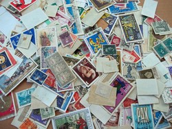 Hundreds of stamps + stamp catalog