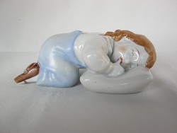 Zsolnay is a sleeping boy lying on a porcelain pillow