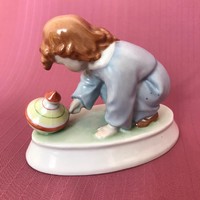 Zsolnay búgócsigás kisfiú, porcelán figura