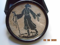 1930 Needle tapestry groom in ornate Hungarian folk costume, silhouette in round frame