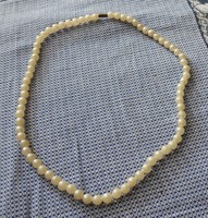 White old plastic string necklace