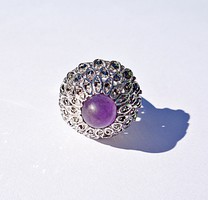 Purple stone ring with marcasite stones in a circle