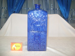 Kék színű kerámia butella domború díszítéssel