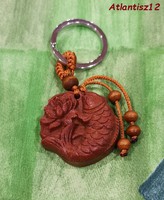 Real room. Feng shui rosewood key ring with lotus fish