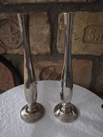 A pair of decorative vases for one flower each