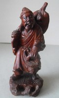 Oriental wanderer, wood carving