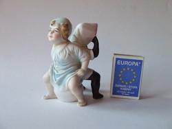 Nagyon különleges antik biszkvit gyermek porcelán szobor, figura-néger és fehér gyerek egy bilin ül