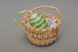 Easter centerpiece, decoration, in a wicker basket, hanging egg