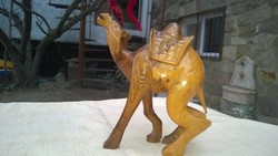 A great wood carving and wooden sculpture in a chubby camel oasis