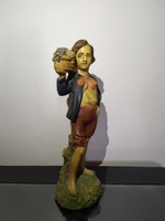 Small sculpture made in the Capodimonte pattern, with a boy's fruit basket