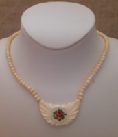 Retro beautiful condition necklace with carved bone medallion adorned with tapestry with screw switch