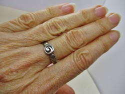 A beautiful small handmade silver ring with a spiral line