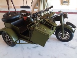 Military sidecar motorcycle equipped with a pistol.