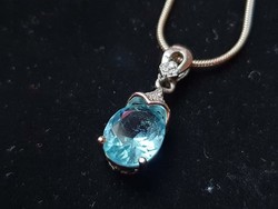 Silver pendant with aquamarine stone and zirconia disc