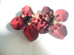Beautiful earrings in the shape of a burgundy flower