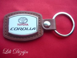 Toyota corolla metal keychain on leather background
