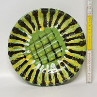 Ceramic wall plate with striped, geometric pattern marked 