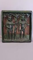 Old scratched ceramic lamp of Adam and Eve