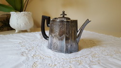 Antique, silver-plated teapot, with patterns engraved in a circle