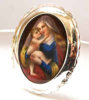 Wonderful, painted, picture of the Virgin Mary with a silver frame on the table!