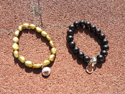 Marked Swedish pearl bracelet pair in one - in black and gold