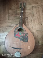 A mandolin with a beautiful intarsia decoration and the mark of the bvt instrument manufacturing company