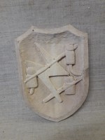 Carved shield.