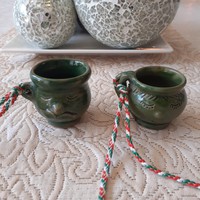 Glasses with green glazed ceramic brandy that can be hung around the neck